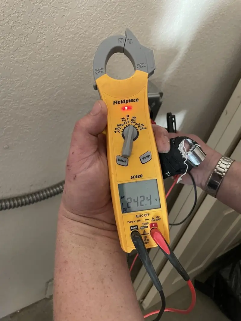 Voltage testing with clamp meter during Electrical Installation Services in Robinson